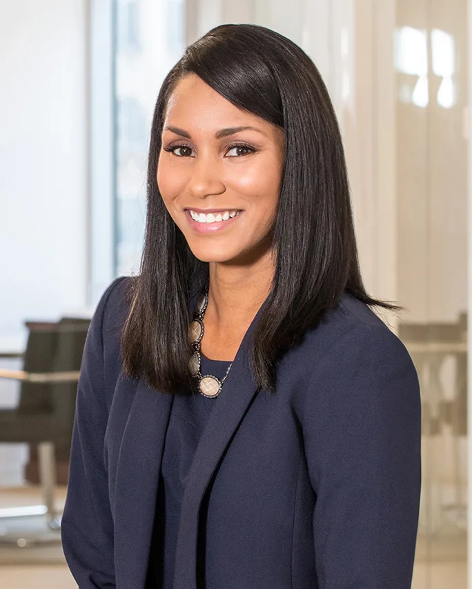 Custom headshot package smiling woman navy blazer modern office background
